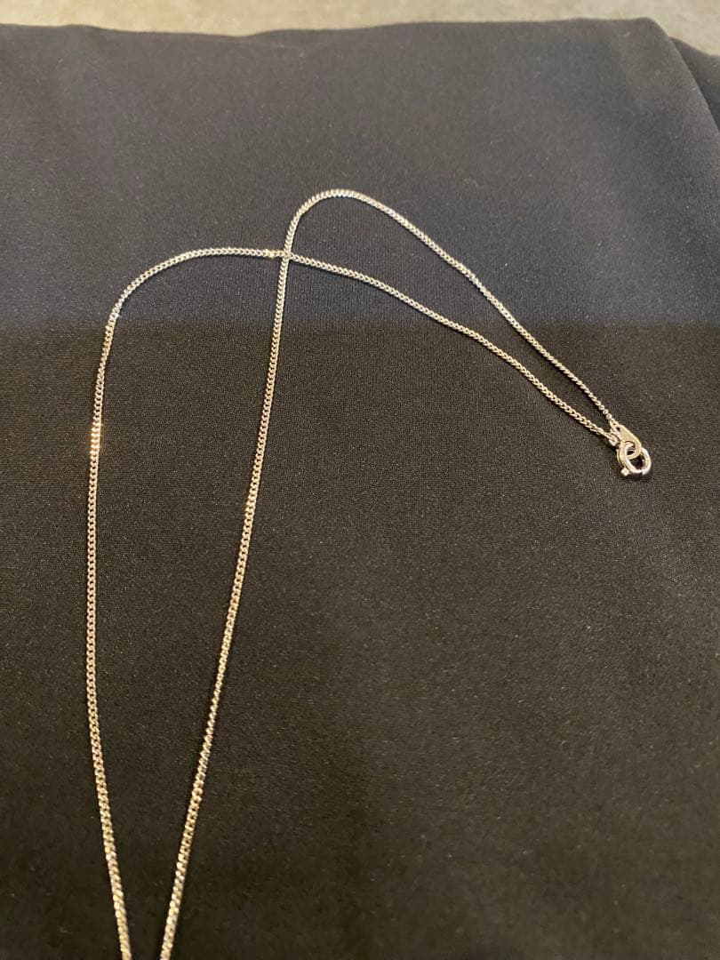 Akoya pearl necklace with 6mm pearls, zirconia accents, and a 38cm chain on a white background