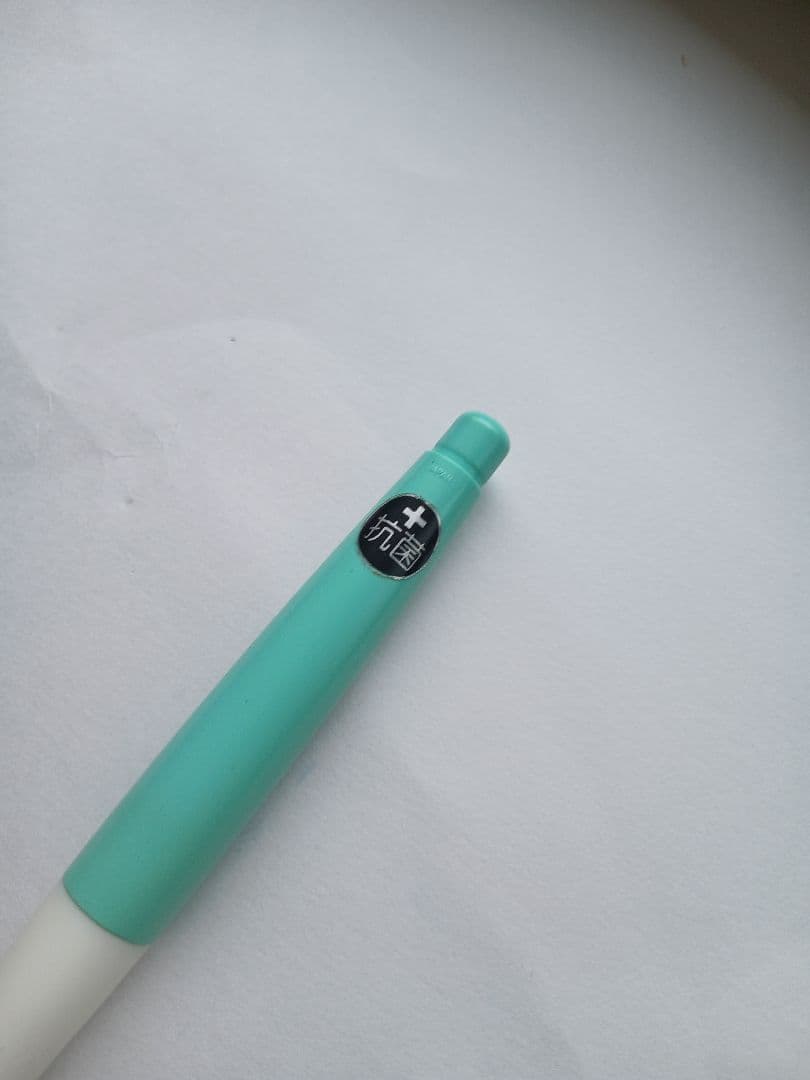 Close-up of a discontinued PILOT Dr.GRIP antibacterial ballpoint pen with visible logo and grip