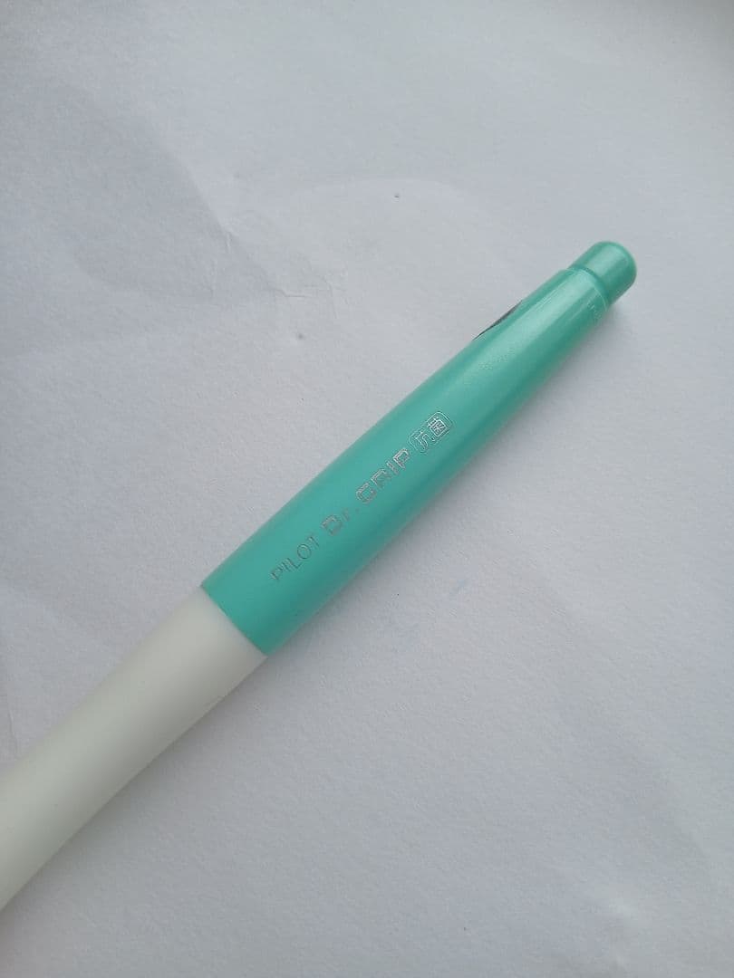 Close-up of a discontinued PILOT Dr.GRIP antibacterial ballpoint pen with visible logo and grip