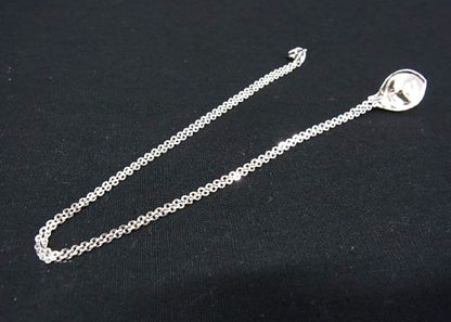 Tasaki pearl necklace with 6mm pearls and 16-inch length displayed on a white background