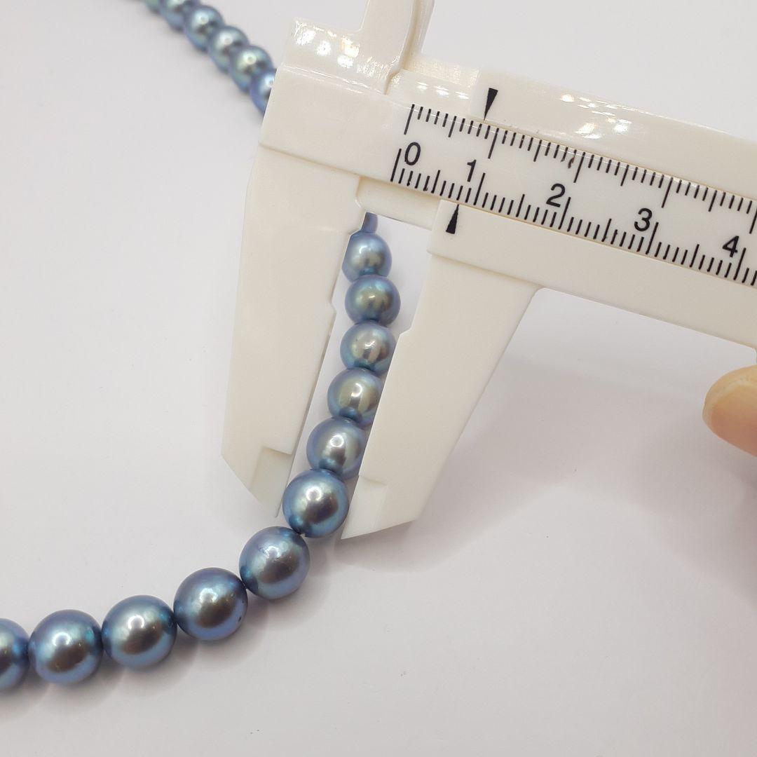 Akoya pearl necklace with 8mm pearls measuring 42.5 cm length on white background