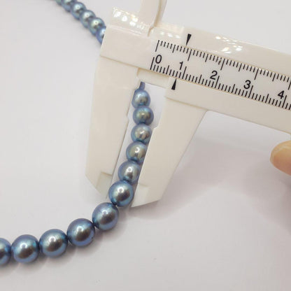Akoya pearl necklace with 8mm pearls measuring 42.5 cm length on white background