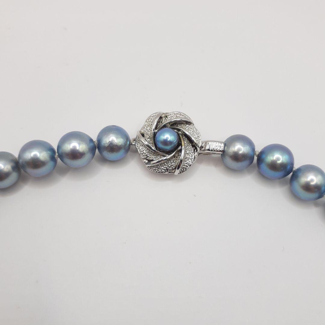 Akoya pearl necklace with 8mm pearls measuring 42.5 cm length on white background