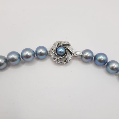 Akoya pearl necklace with 8mm pearls measuring 42.5 cm length on white background
