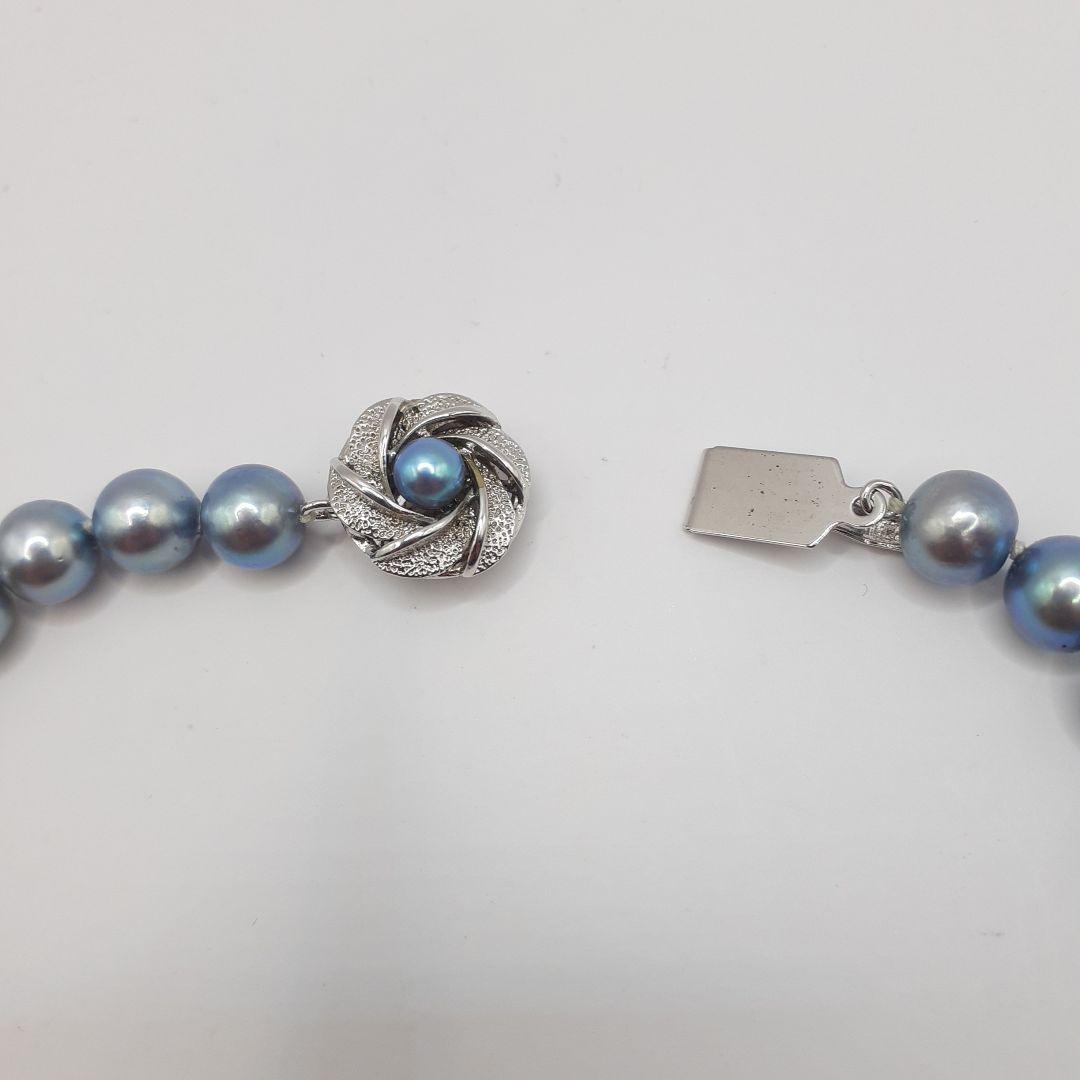 Akoya pearl necklace with 8mm pearls measuring 42.5 cm length on white background