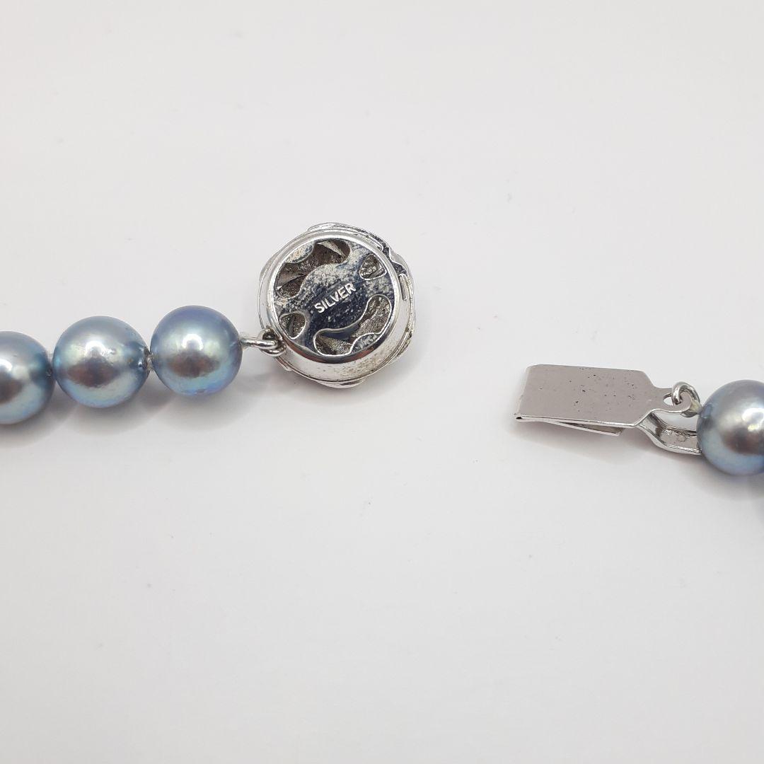Akoya pearl necklace with 8mm pearls measuring 42.5 cm length on white background