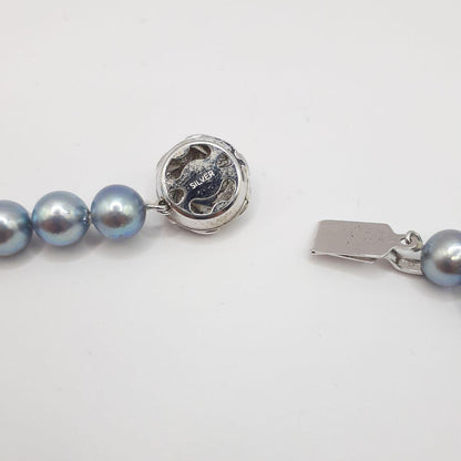 Akoya pearl necklace with 8mm pearls measuring 42.5 cm length on white background