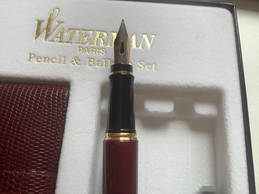 Waterman fountain pen and ballpoint pen set displayed in a brown leather case