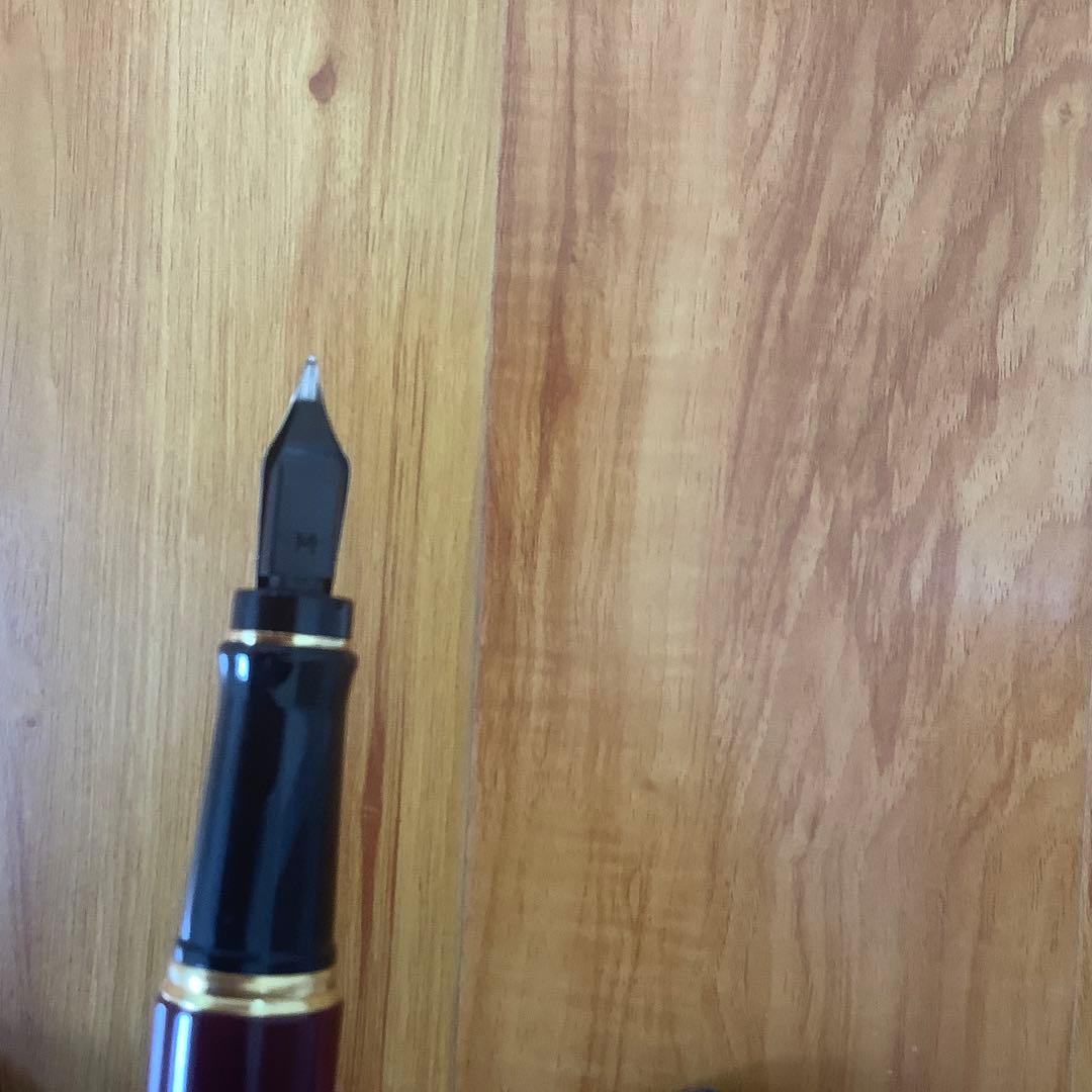 Waterman fountain pen and ballpoint pen set displayed in a brown leather case