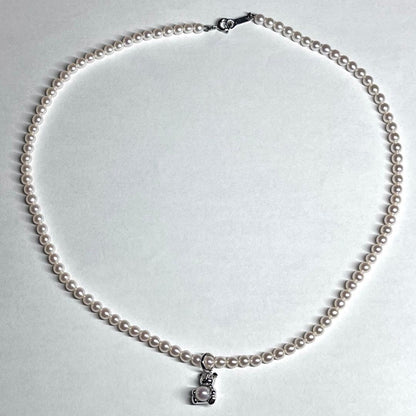 Tasaki Bear Charm Pearl Necklace with silver hallmark, 43 cm length, displayed on a white background