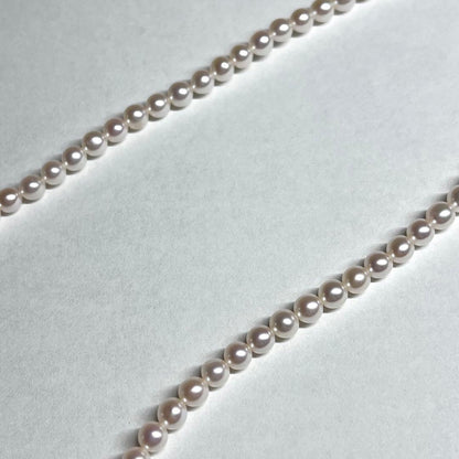 Tasaki Bear Charm Pearl Necklace with silver hallmark, 43 cm length, displayed on a white background