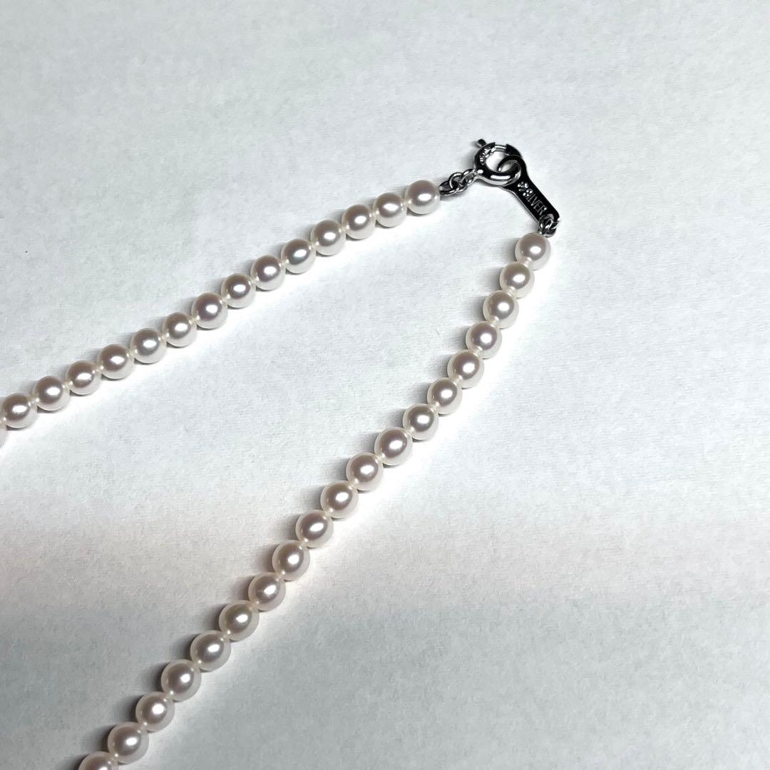Tasaki Bear Charm Pearl Necklace with silver hallmark, 43 cm length, displayed on a white background