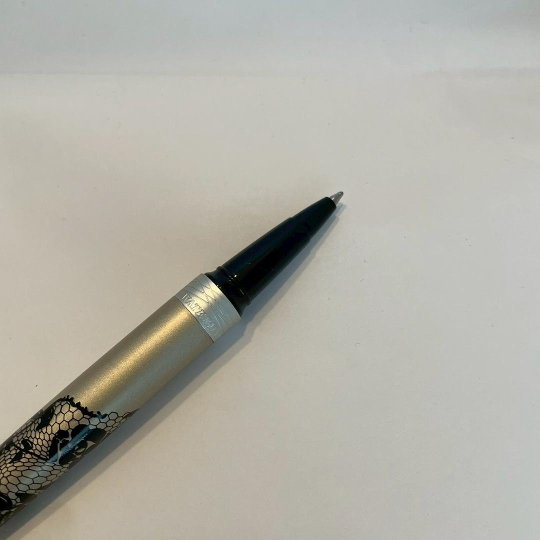 Waterman Audace ballpoint pen with a rose pattern cap, displayed uncapped showing its sleek design