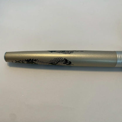Waterman Audace ballpoint pen with a rose pattern cap, displayed uncapped showing its sleek design