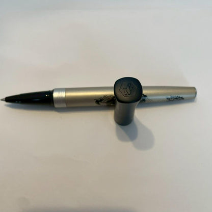 Waterman Audace ballpoint pen with a rose pattern cap, displayed uncapped showing its sleek design