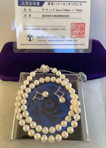 High-quality Akoya pearl necklace and earring set with 7.5mm white round pearls on a white background