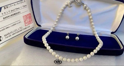 High-quality Akoya pearl necklace and earring set with 7.5mm white round pearls on a white background