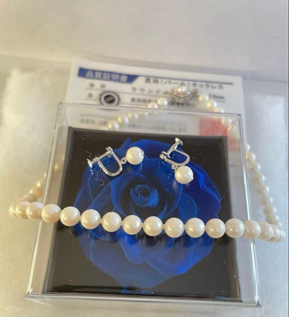 High-quality Akoya pearl necklace and earring set with 7.5mm white round pearls on a white background
