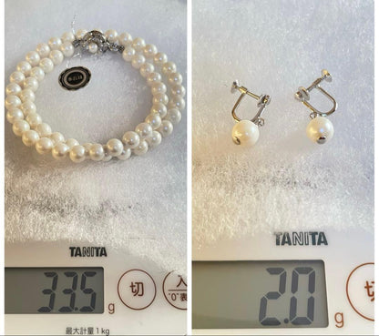 High-quality Akoya pearl necklace and earring set with 7.5mm white round pearls on a white background