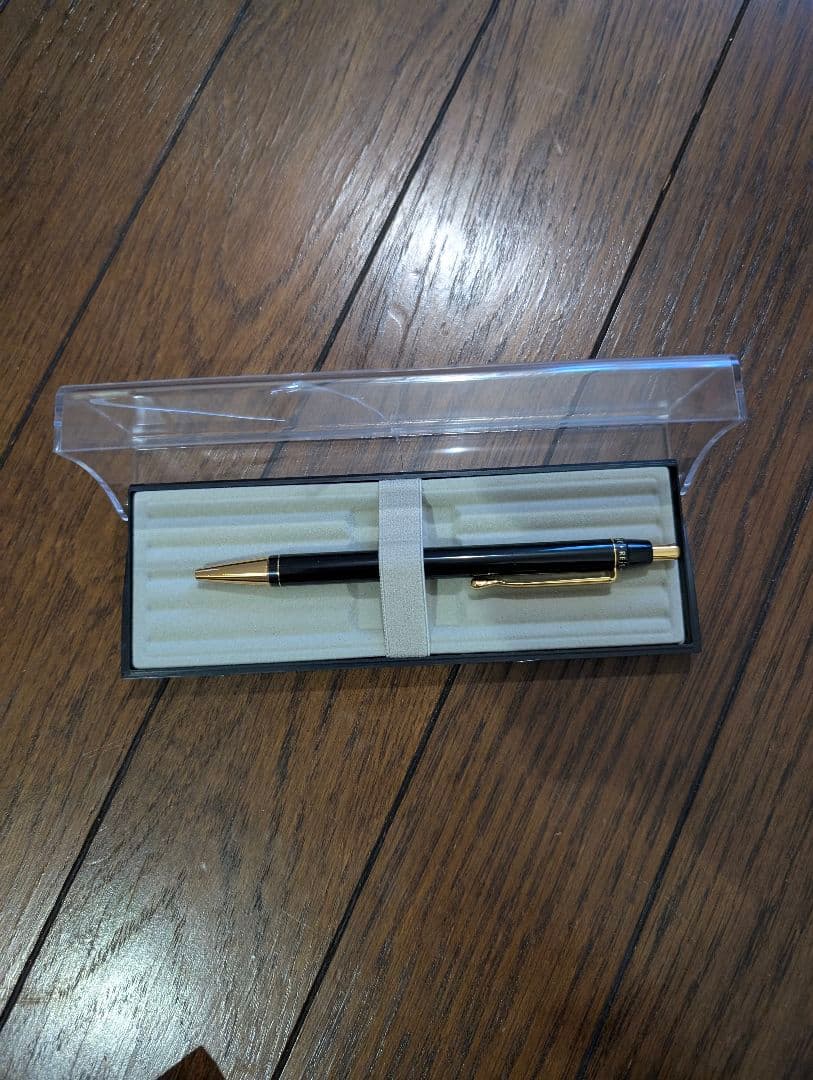 PILOT Oil-Based Ballpoint Pen in black with gold clip and tip shown with instruction manual