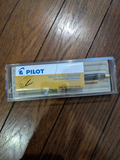 PILOT Oil-Based Ballpoint Pen in black with gold clip and tip shown with instruction manual