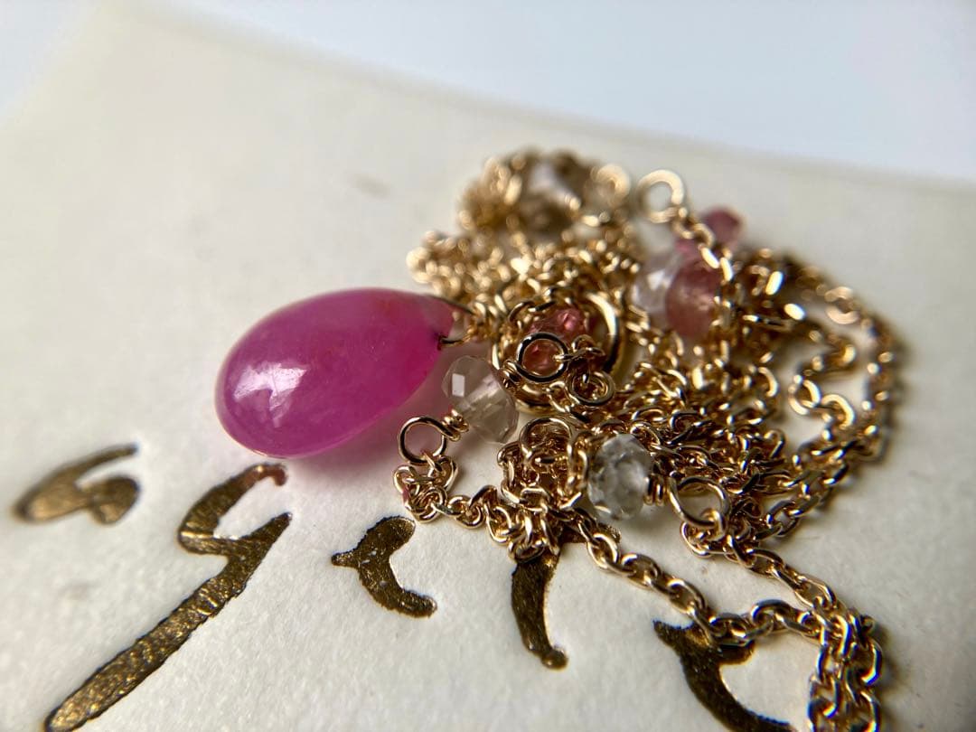 Agete Law pink and purple color stone pendant on a 38cm gold K10 necklace