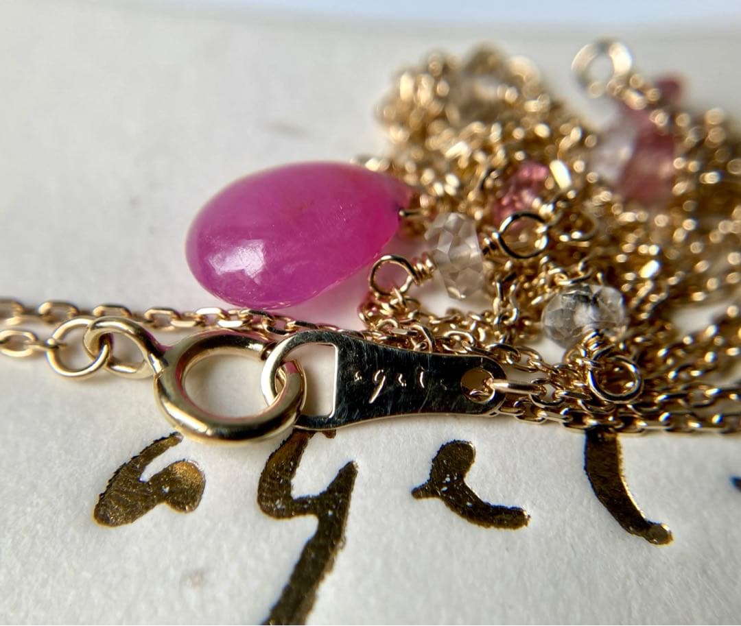 Agete Law pink and purple color stone pendant on a 38cm gold K10 necklace