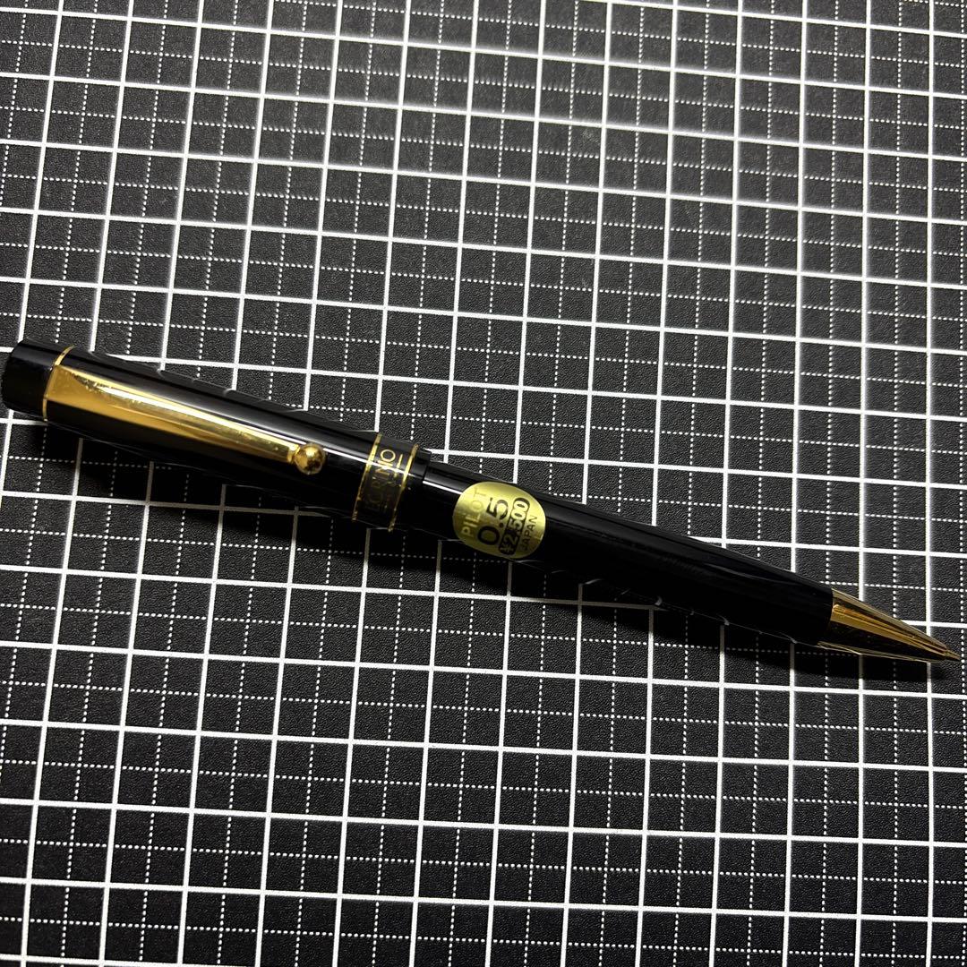 Pilot Ecrineno mechanical pencil in black and gold with box and sticker on white background