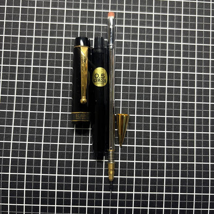 Pilot Ecrineno mechanical pencil in black and gold with box and sticker on white background