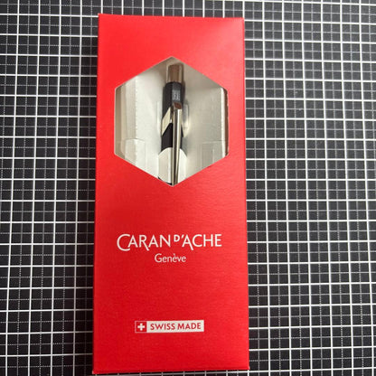 Pilot Ecrineno mechanical pencil in black and gold with box and sticker on white background