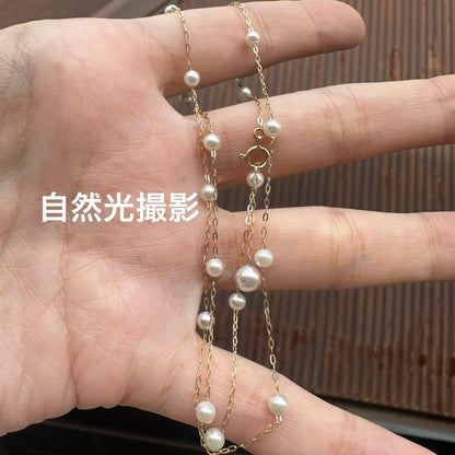 K10YG yellow gold necklace with 17 Akoya pearls ranging 3-6 mm, 45 cm length