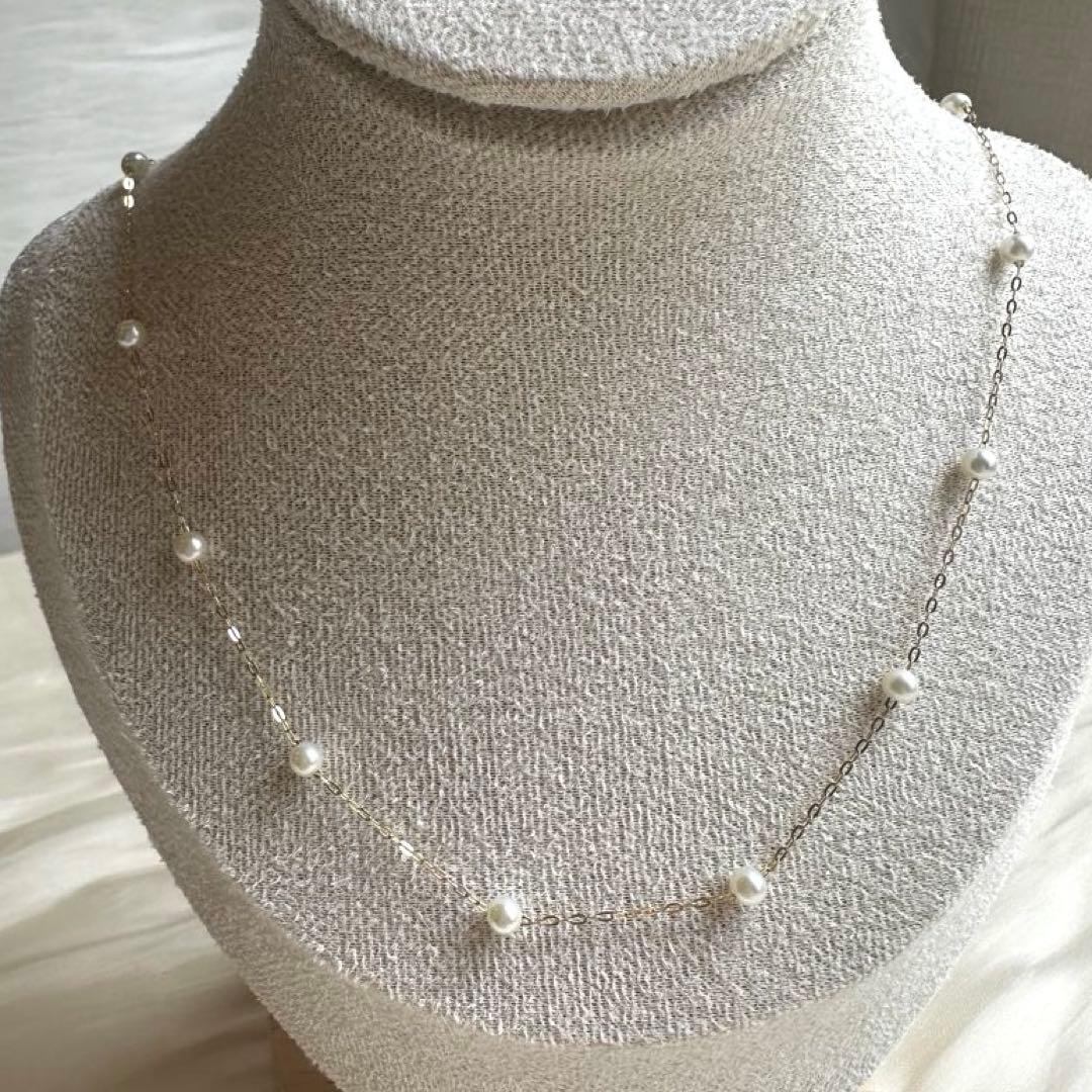 K10YG yellow gold necklace with 17 Akoya pearls ranging 3-6 mm, 45 cm length