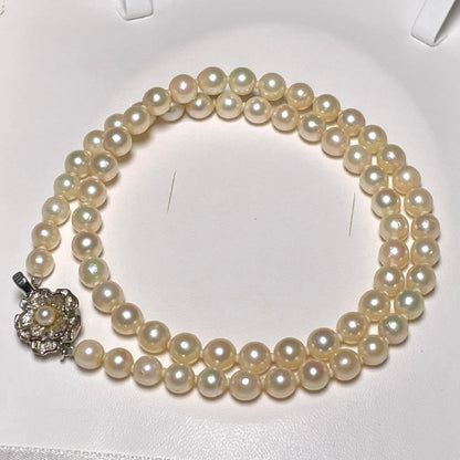 Akoya pearl necklace with round white pearls measuring 5.8-6.4mm on a 46.7cm silver chain