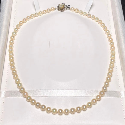 Akoya pearl necklace with round white pearls measuring 5.8-6.4mm on a 46.7cm silver chain