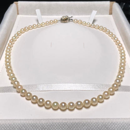 Akoya pearl necklace with round white pearls measuring 5.8-6.4mm on a 46.7cm silver chain