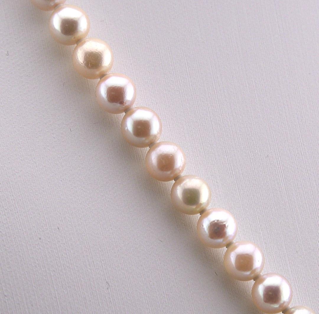 Akoya pearl necklace featuring 6.0 to 6.5mm pearls with silver clasp and safety chain on 45.5 cm strand