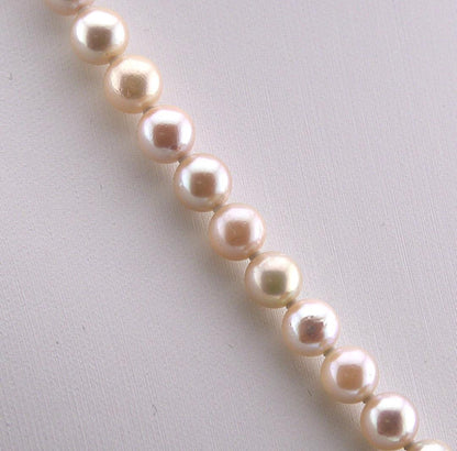 Akoya pearl necklace featuring 6.0 to 6.5mm pearls with silver clasp and safety chain on 45.5 cm strand