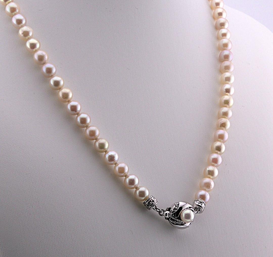Akoya pearl necklace featuring 6.0 to 6.5mm pearls with silver clasp and safety chain on 45.5 cm strand
