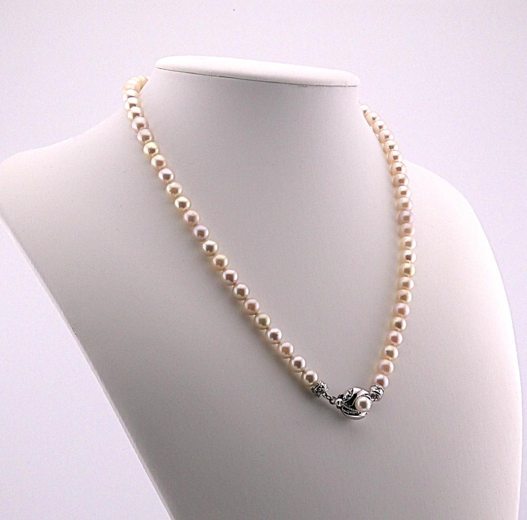 Akoya pearl necklace featuring 6.0 to 6.5mm pearls with silver clasp and safety chain on 45.5 cm strand