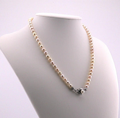 Akoya pearl necklace featuring 6.0 to 6.5mm pearls with silver clasp and safety chain on 45.5 cm strand
