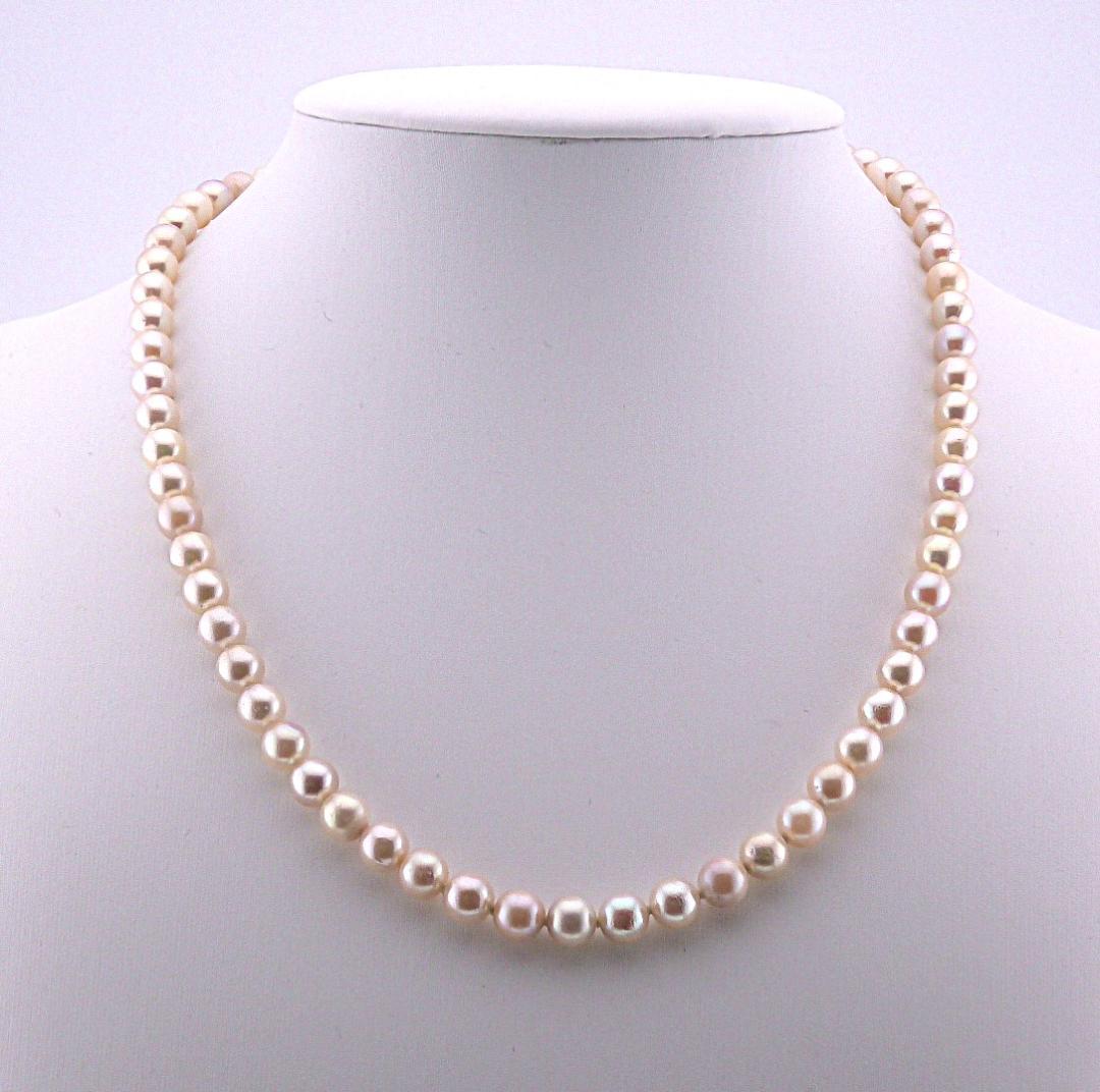 Akoya pearl necklace featuring 6.0 to 6.5mm pearls with silver clasp and safety chain on 45.5 cm strand