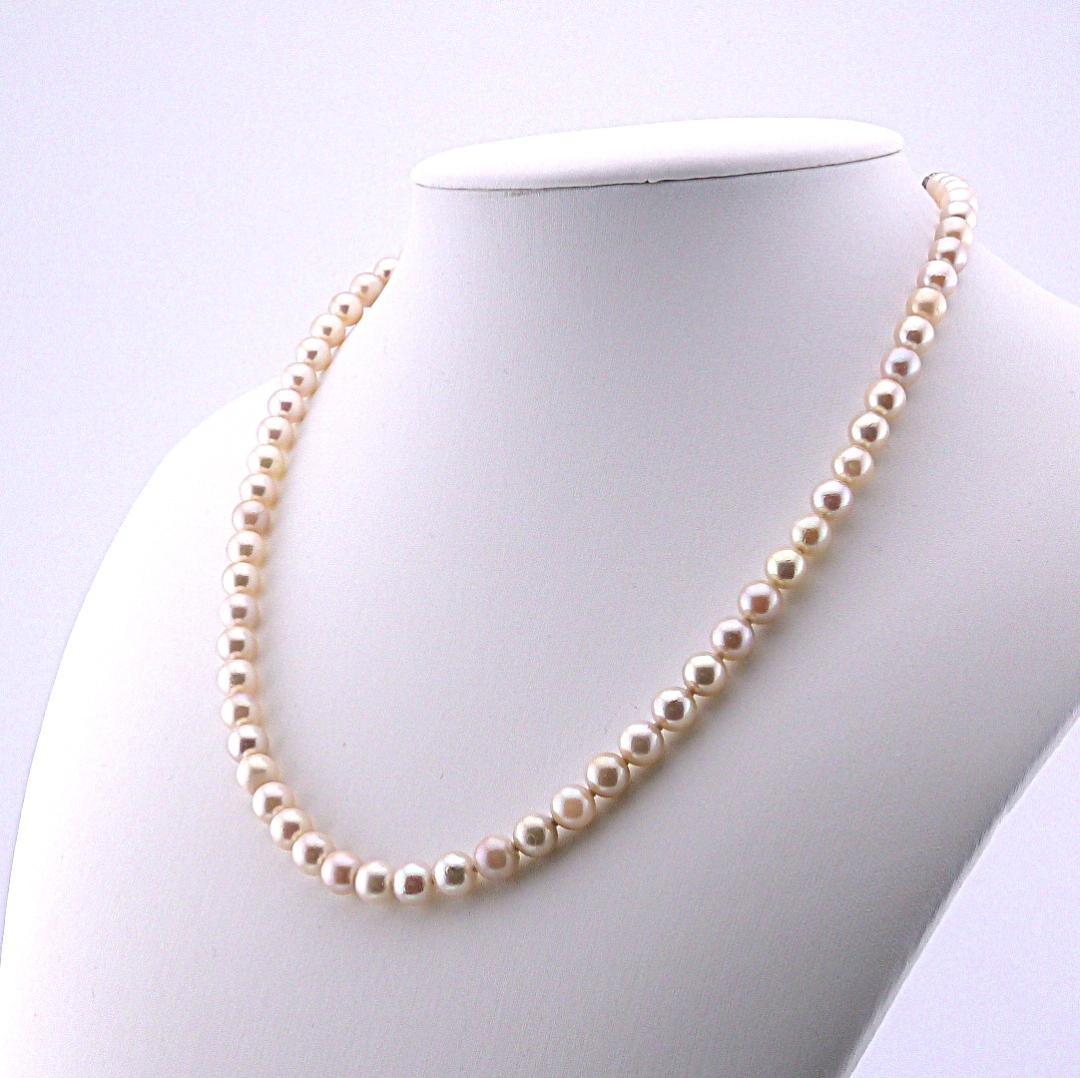 Akoya pearl necklace featuring 6.0 to 6.5mm pearls with silver clasp and safety chain on 45.5 cm strand