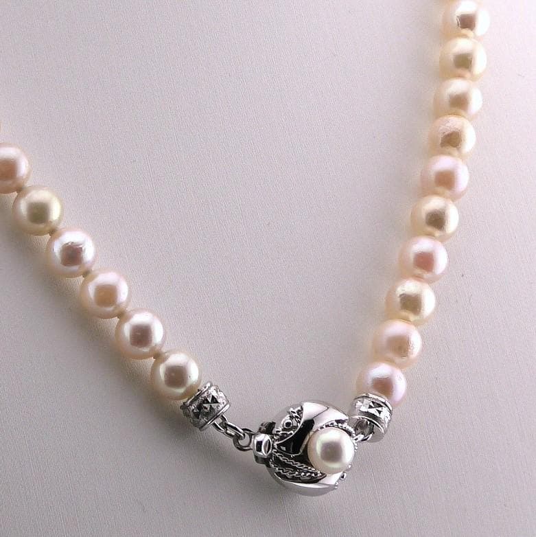 Akoya pearl necklace featuring 6.0 to 6.5mm pearls with silver clasp and safety chain on 45.5 cm strand