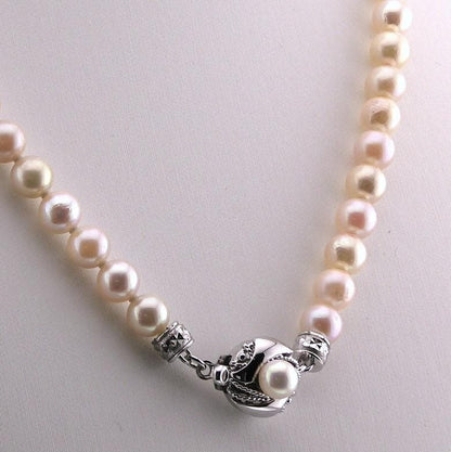 Akoya pearl necklace featuring 6.0 to 6.5mm pearls with silver clasp and safety chain on 45.5 cm strand