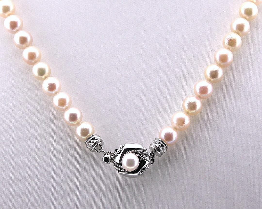 Akoya pearl necklace featuring 6.0 to 6.5mm pearls with silver clasp and safety chain on 45.5 cm strand