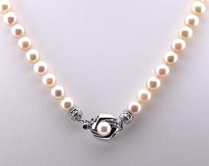 Akoya pearl necklace featuring 6.0 to 6.5mm pearls with silver clasp and safety chain on 45.5 cm strand