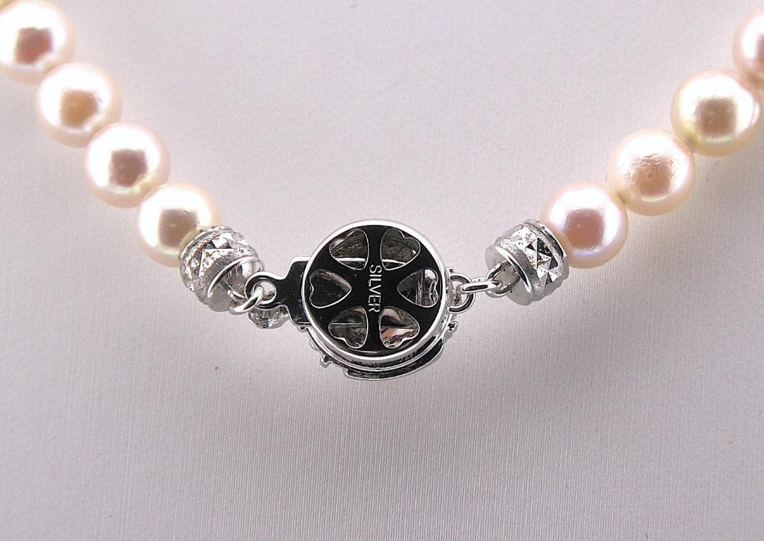 Akoya pearl necklace featuring 6.0 to 6.5mm pearls with silver clasp and safety chain on 45.5 cm strand