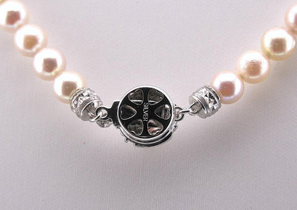 Akoya pearl necklace featuring 6.0 to 6.5mm pearls with silver clasp and safety chain on 45.5 cm strand