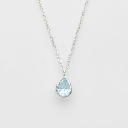 Agete silver necklace with a small blue topaz pendant 0.82 cm vertical and 0.63 cm horizontal on a 50 cm chain with box