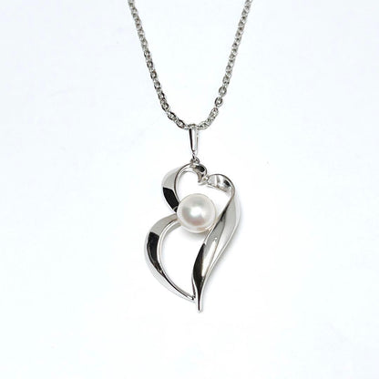 MIKIMOTO genuine pearl necklace featuring 6.7mm pearls on a silver chain weighing 2.3 grams